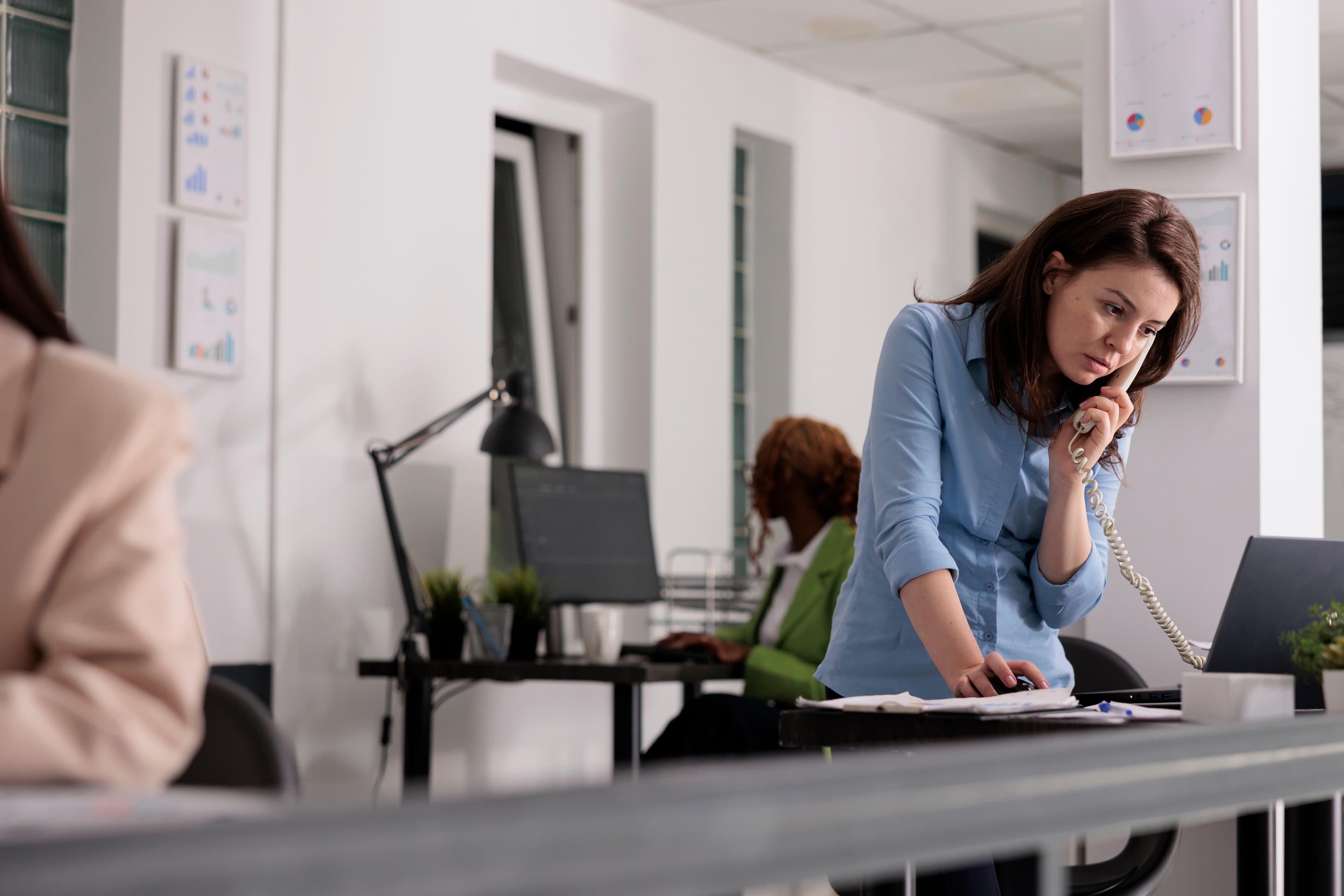 Small business owner on phone getting help with Cyber security